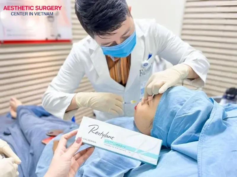 The doctor injects dermal filler into the nose area to create a more refined and elevated nose bridge