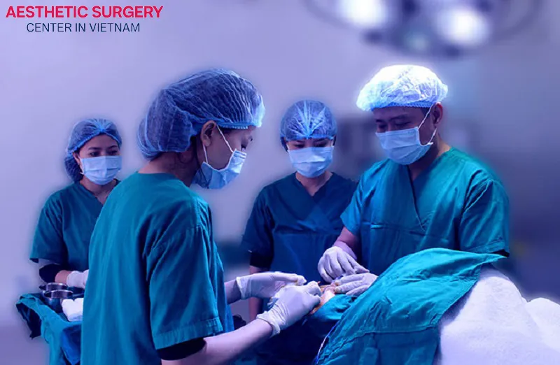 The surgeon performs the forehead lift surgery.