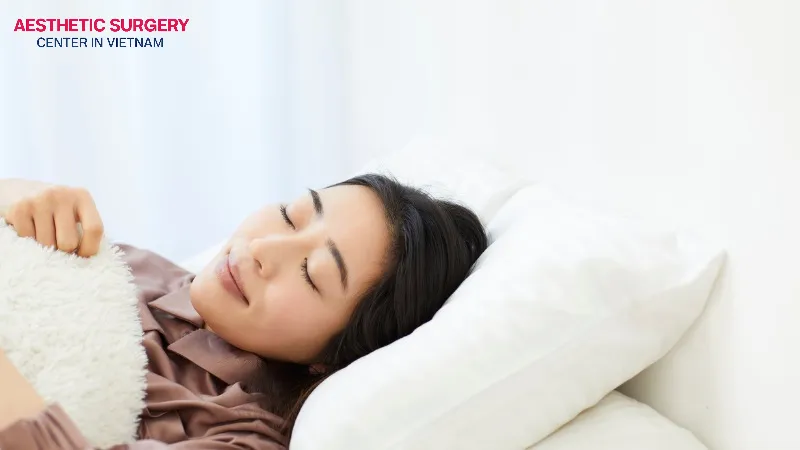 Keep your head elevated with a pillow while sleeping to help reduce swelling and improve blood circulation.