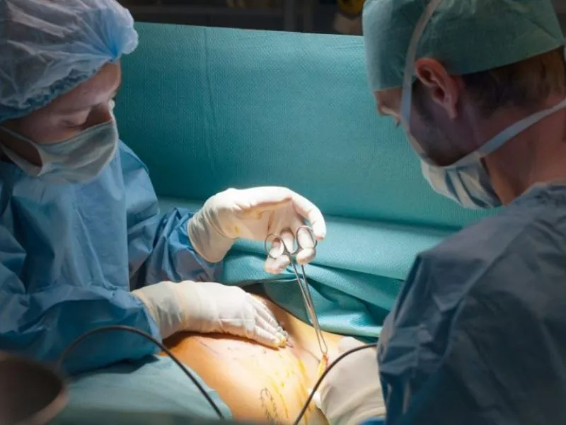 The surgeon performs a transaxillary breast augmentation.