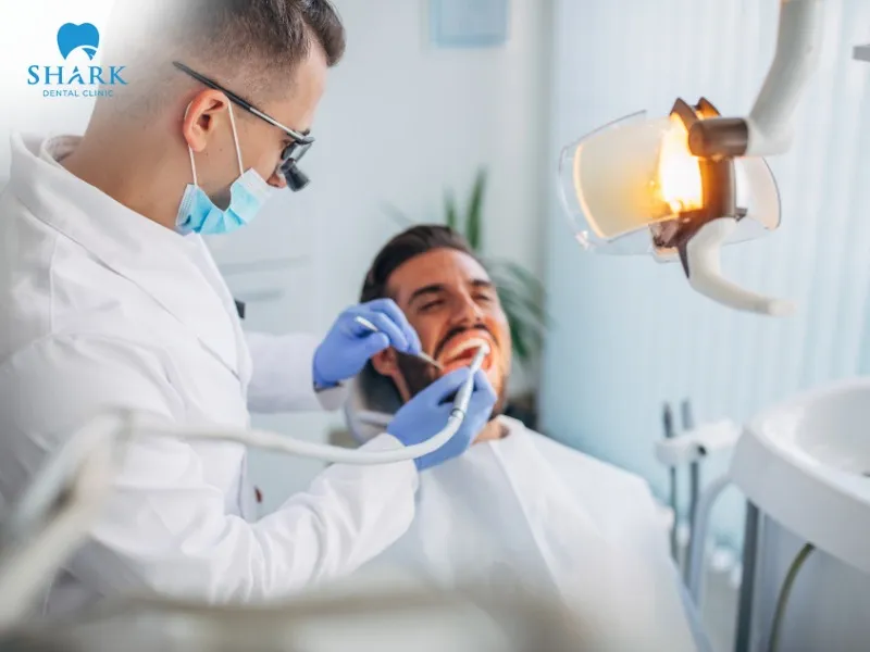 The patient undergoes thorough oral cleaning to eliminate the risk of infection before implant placement