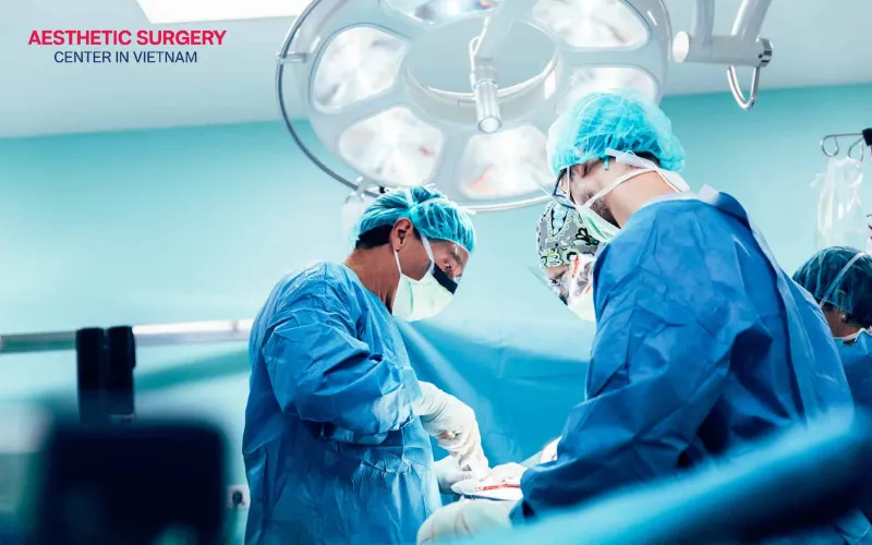 The procedure is completed with the placement of a surgical drain and the careful closure of the incision.