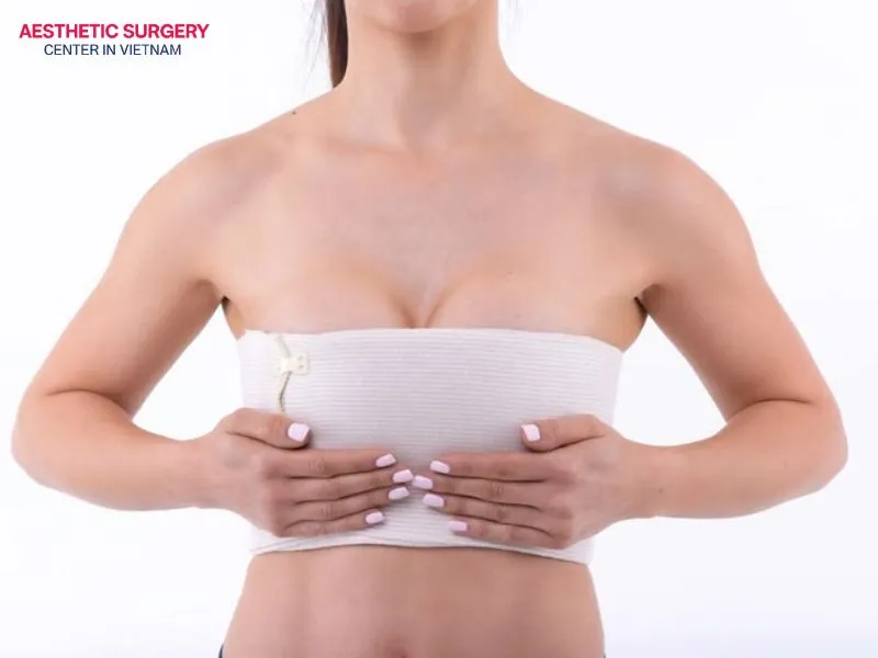Wearing a supportive compression bra helps support the breasts and reduce the forward weight that the body has to carry