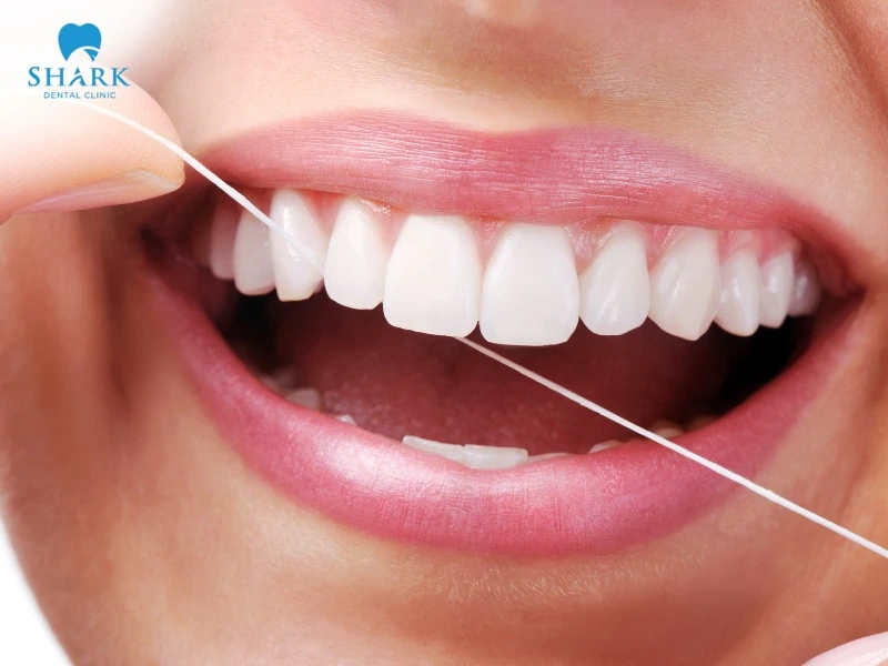 Dental floss helps remove leftover food stuck between teeth that a toothbrush cannot reach