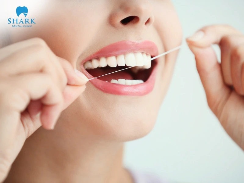 Flossing helps prevent bad breath by cleaning trapped food particles and bacteria