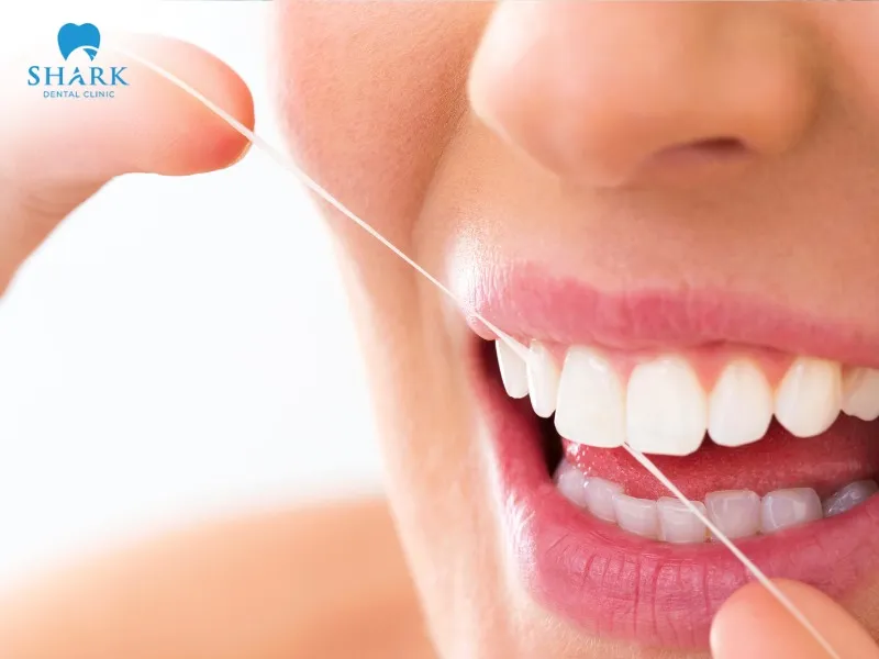 You should prioritize using dental floss to clean crowned teeth after restoration