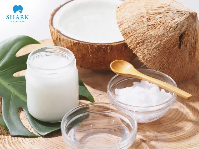 Mix baking soda powder with coconut oil to whiten teeth