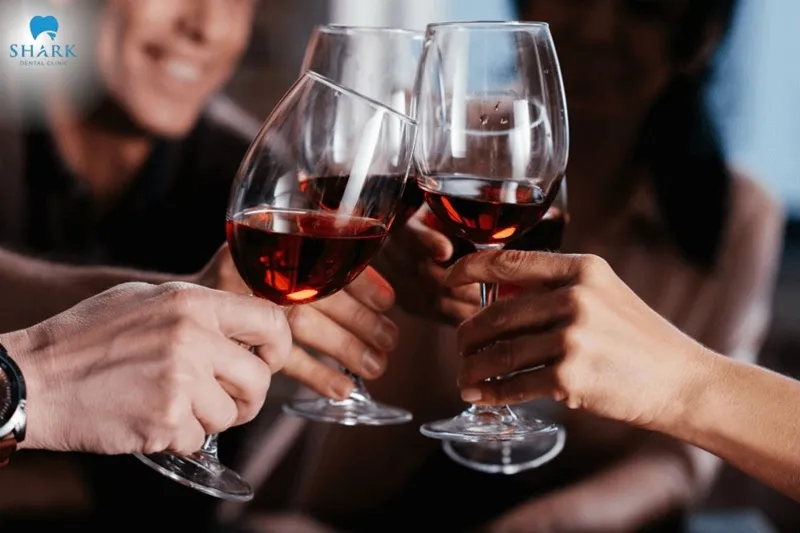 You should avoid consuming alcohol after teeth cleaning, as it can quickly stain teeth and irritate the gums