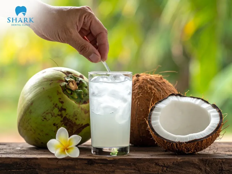 Drinking water or fresh coconut water helps clean the mouth without damaging the enamel