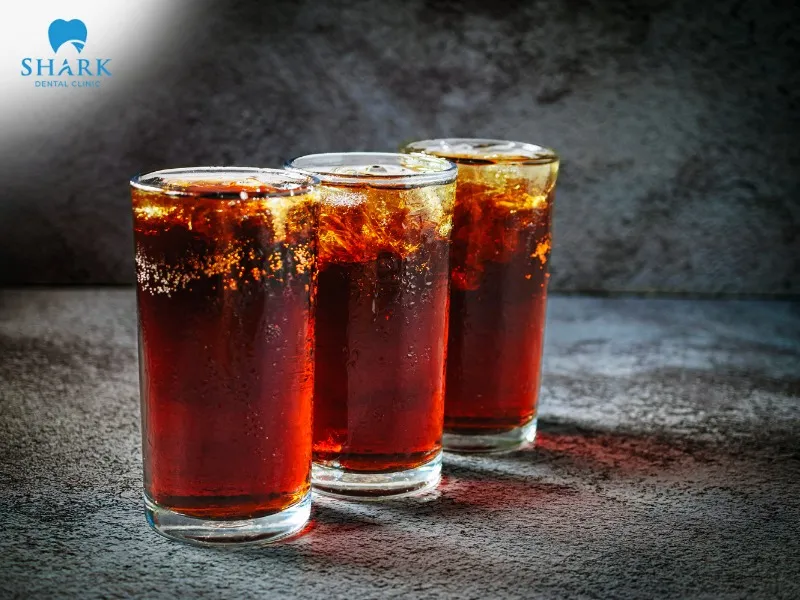 You should avoid drinking carbonated soft drinks after applying whitening strips