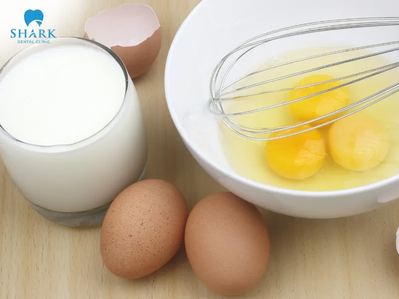 About two months after getting dental implants, you should prioritize calcium-rich foods like eggs, milk, and cheese