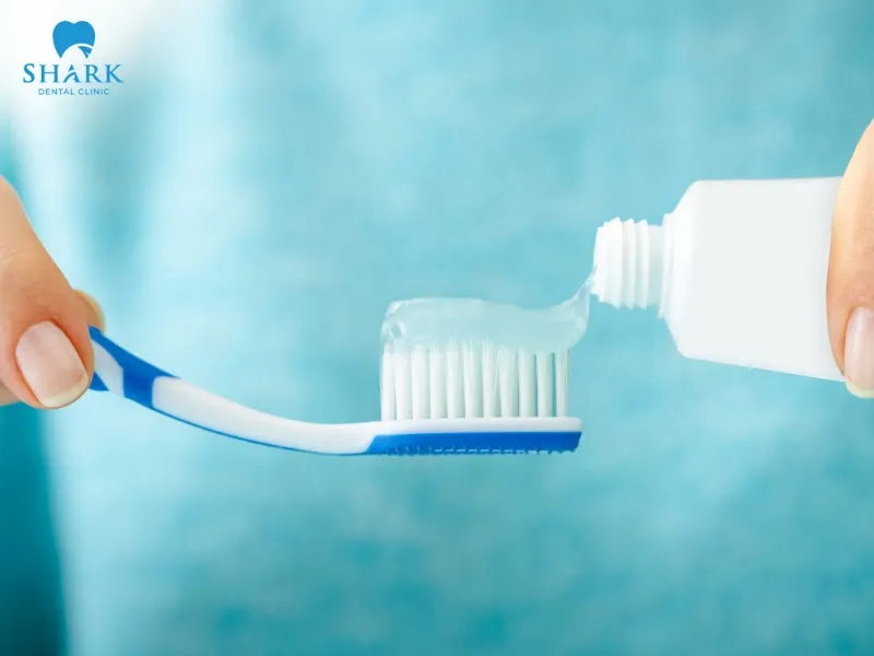 You should brush your teeth gently on all three surfaces — chewing, outer, and inner — after dental implant placement