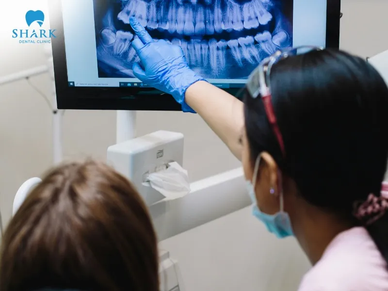 You need to evaluate the white, gray, and black shades on the X-ray film to make an initial assessment of your oral condition