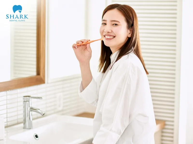You still need to brush your teeth at least 2–3 times a day to keep your oral cavity clean