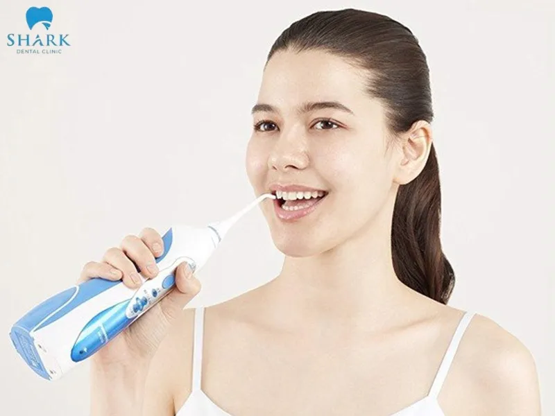 Use dental floss or a water flosser to clean the spaces between the teeth without affecting the porcelain crown