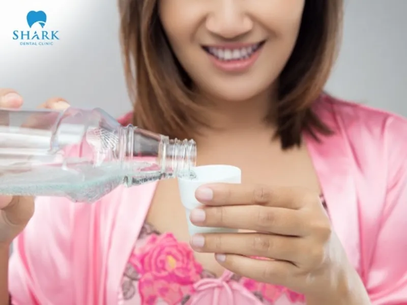 You should start rinsing with salt water about 24 hours after tooth extraction