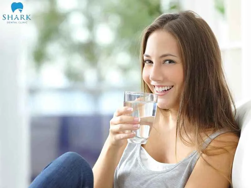 Prioritize drinking plenty of plain water after tooth extraction to help maintain body hydration and support the healing process