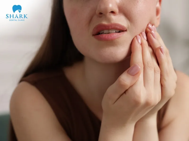 Eating a cheeseburger too soon after tooth extraction can cause pain and unpleasant sensitivity