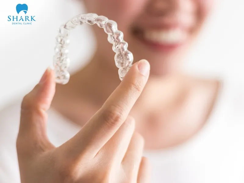 Invisalign uses clear aligners that are custom-designed to fit each patient’s dental arch