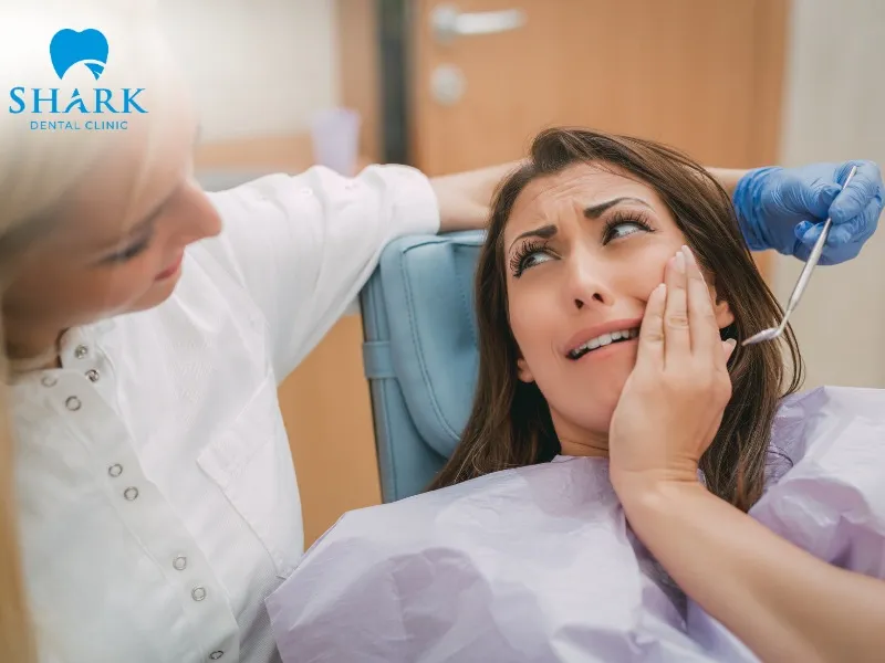 Bad breath after tooth extraction, accompanied by swollen and painful gums, is a typical warning sign of a possible infection that should be checked promptly