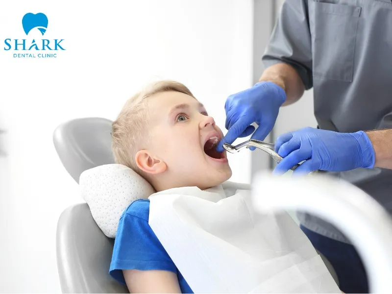 The dentist will examine the child’s overall oral health before performing kids tooth extraction