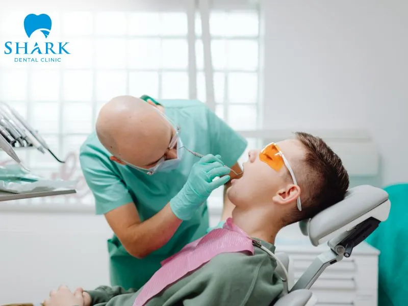A partially erupted wisdom tooth may place pressure on the adjacent second molar