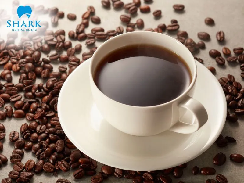 You should limit your coffee intake after having a tooth implant placed