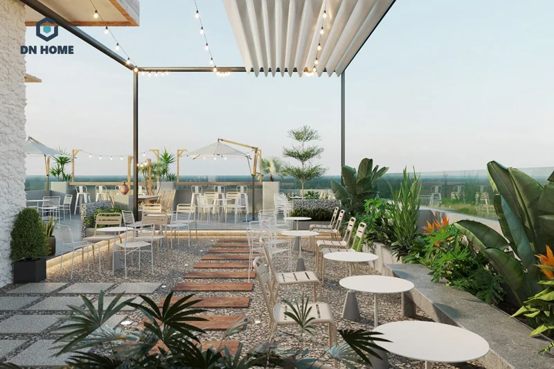 Quán cafe sân vườn thường trang trí cây cảnh, sỏi đá tạo nên không gian gần gũi với thiên nhiên