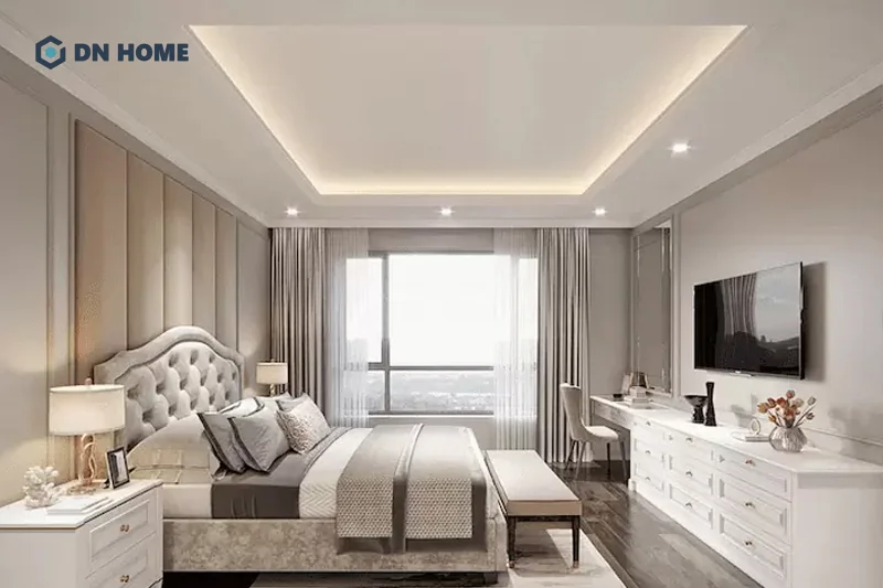 Trần thạch cao chìm giật cấp kết hợp với hệ thống đèn tạo điểm nhấn và chiều sâu cho phòng ngủ
