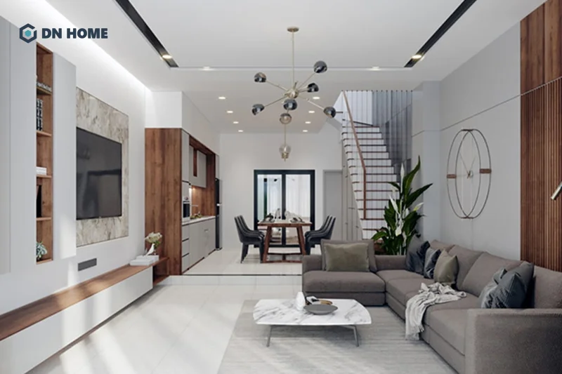 Đèn chùm là điểm nhấn cần thiết khi thiết kế phòng khách có cầu thang phong cách sang trọng