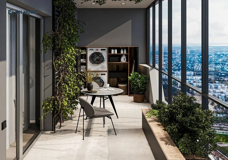 Thiết kế ban công chung cư có chỗ để máy giặt và bộ bàn ghế nhỏ để đọc sách hoặc uống trà thư giãn