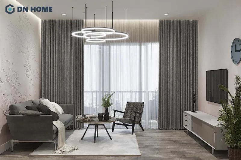 Kết hợp hài hòa ánh sáng tự nhiên và nhân tạo giúp không gian phòng khách chung cư thêm thoáng đãng và ấm cúng