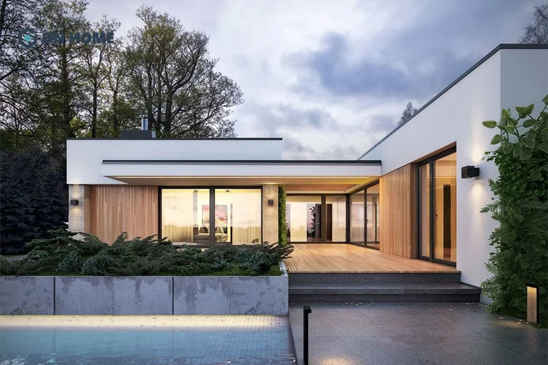 Hệ cửa kính lớn thường được ứng dụng trong khi thiết kế nhà chữ L 1 tầng hiện đại, tối giản