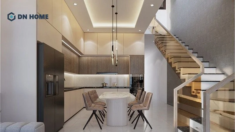 Mẫu thiết kế nhà 2 tầng 6x15m 3 phòng ngủ với không gian bếp sang trọng, sử dụng ánh sáng vàng nhẹ làm nổi bật không gian