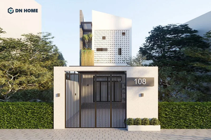 Hệ mái lệch và các hình khối tạo điểm nhấn ấn tượng cho nhà ống 2 tầng có sân vườn và gara