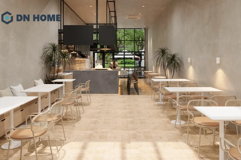 Cửa chính được làm bằng kính giúp không gian quán cafe 6m tối giản nhận được tối đa ánh sáng tự nhiên