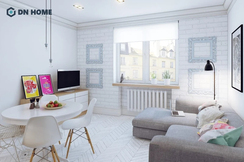 Phòng khách chung cư 25m2 có thể sử dụng thêm kệ treo tường để trang trí