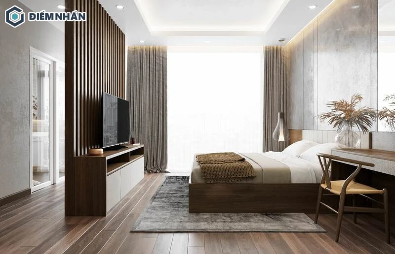 Vách ngăn phòng ngủ dạng lam gỗ kết hợp kệ tủ tivi, vừa ngăn chia không gian vừa tối ưu công năng sử dụng