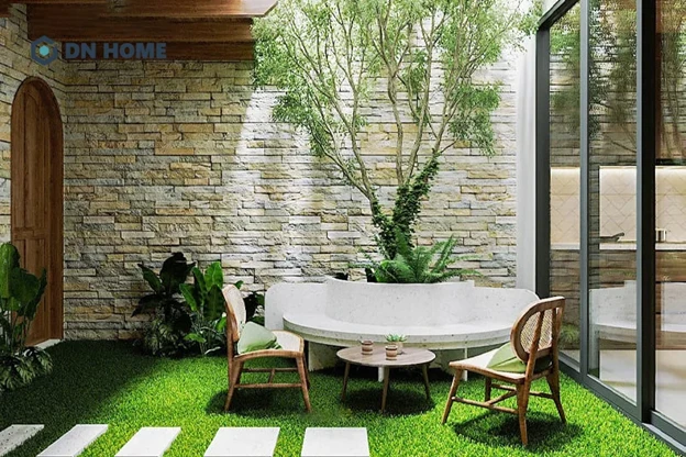 Tiểu cảnh sân vườn sau nhà thường đặt thêm bàn ghế để làm nơi uống trà, đọc sách,...