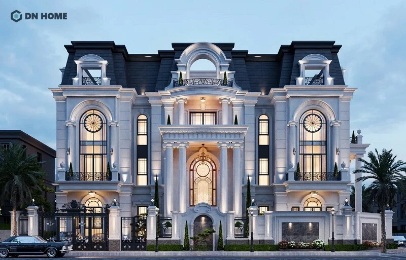 Hệ mái Mansard đen tuyền làm nổi bật lên sự tương phản mạnh mẽ với màu sơn trắng sứ của tường