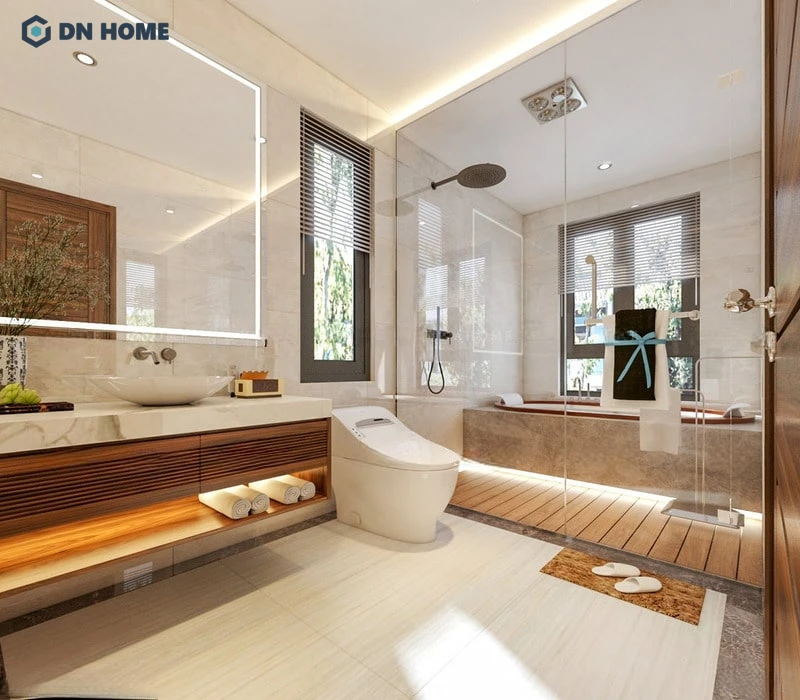Với khu vực nhà vệ sinh, nội thất gỗ óc chó được lồng ghép khéo léo vào các kệ tủ kết hợp với mặt đá tự nhiên sang trọng