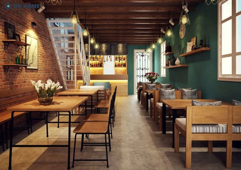 Kết hợp gam màu xanh đậm cổ điển tạo điểm nhấn thẩm mỹ cho tổng thể tiệm cafe mộc